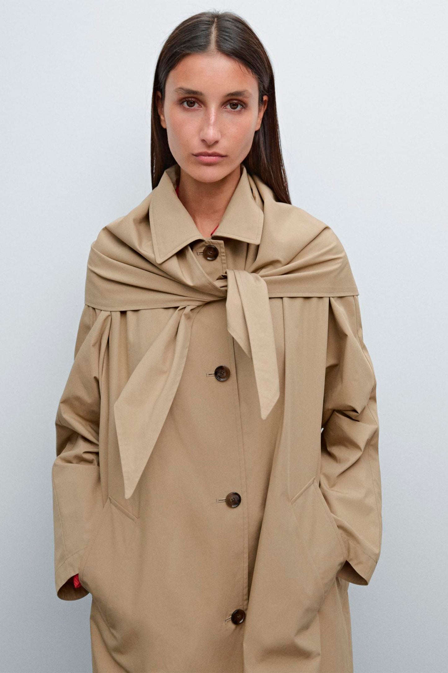 Trench coat with detachable scarf detail