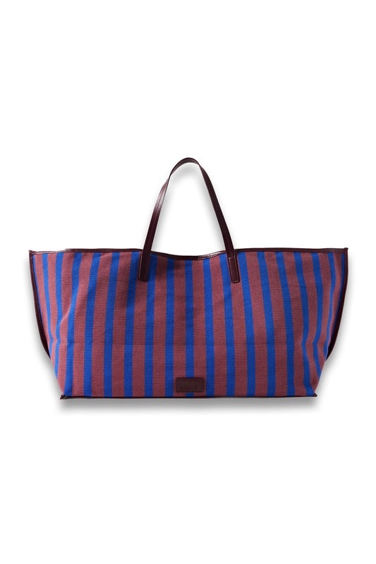 Striped tote bag with red and blue pattern on a white background