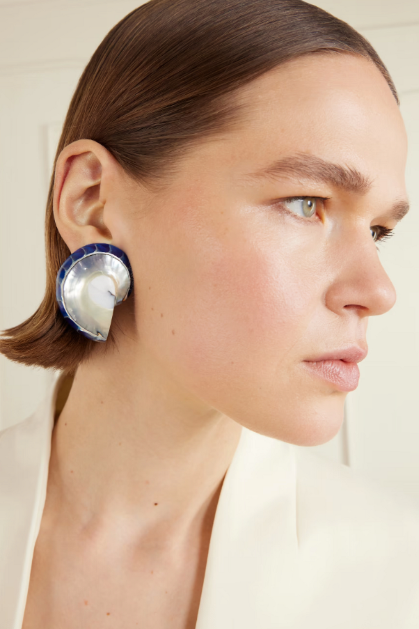 Exclusive rhodium-plated, shell and resin earrings