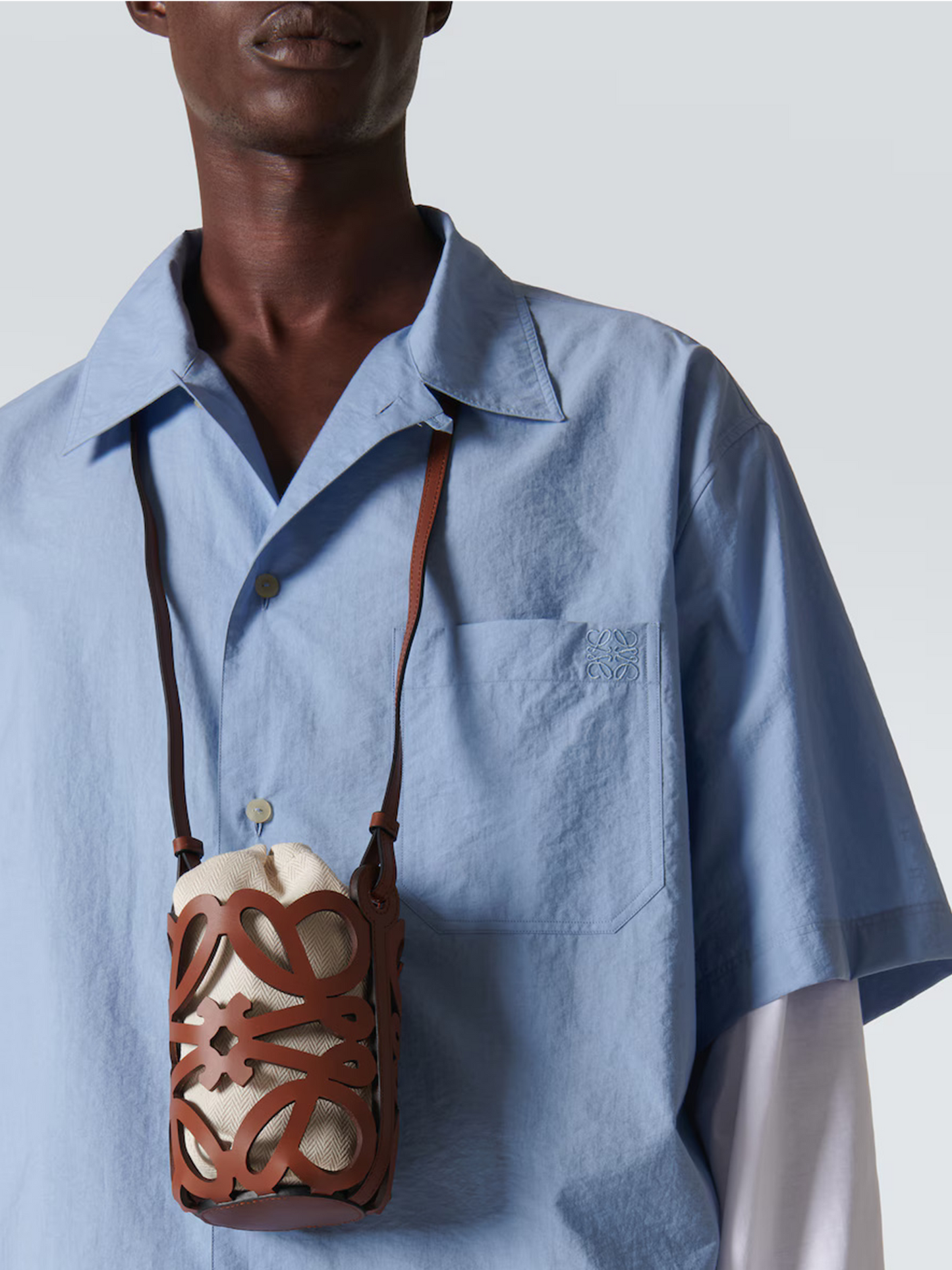 Anagram leather-trimmed canvas bucket bag