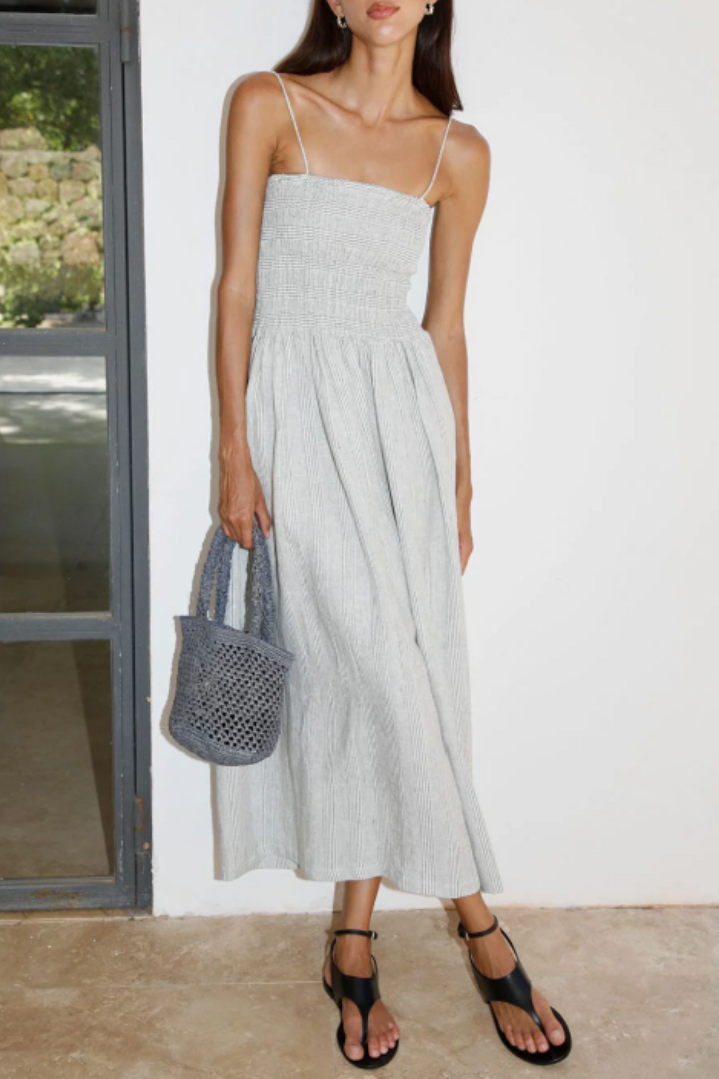 The Harlow Smocked Maxi Dress in striped olive green