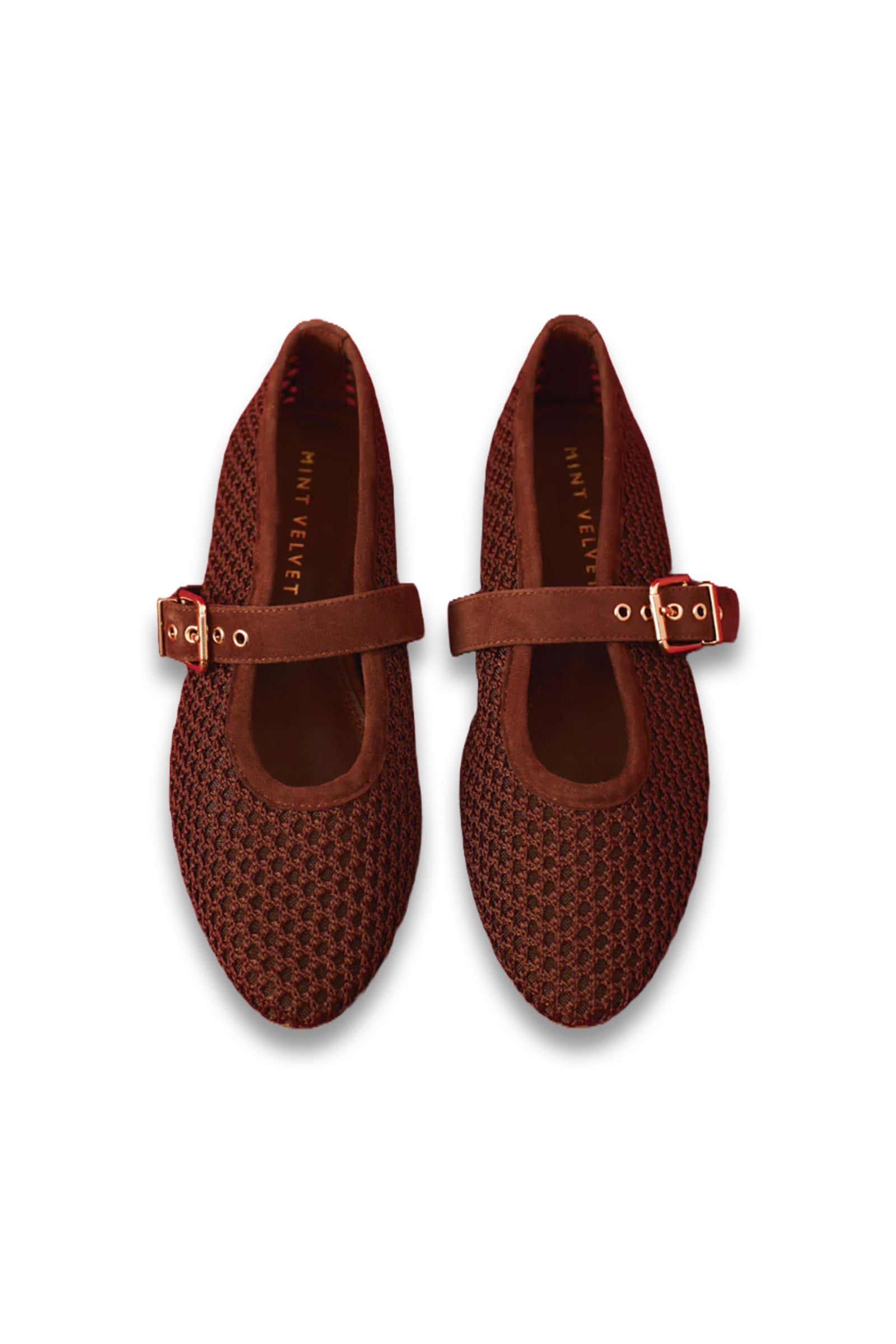 Pair of brown woven shoes with buckles on a white background
